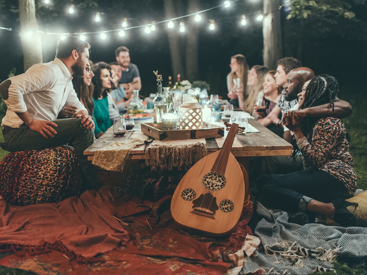 Family and friends sharing a meal outdoors